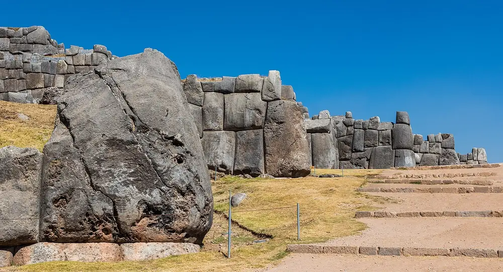 A long wall of huge irregular stone blocks fitted closely together without mortar